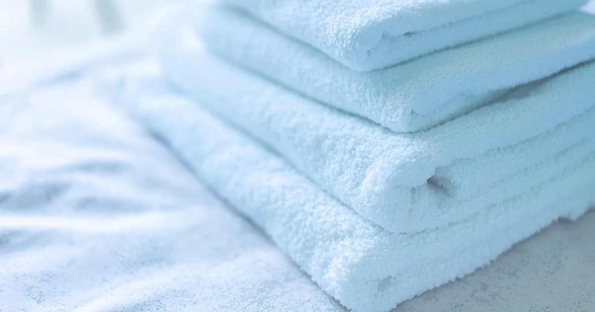 Clean white towels folded in a stack